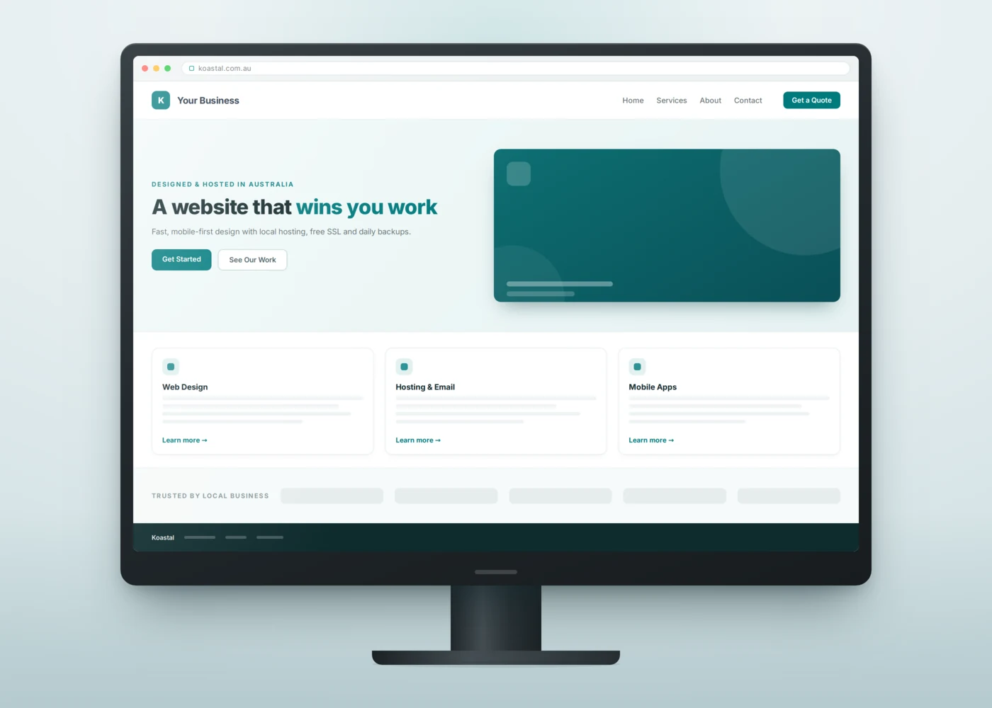 Desktop monitor displaying a modern small-business website with a hero section, service cards and a call-to-action button